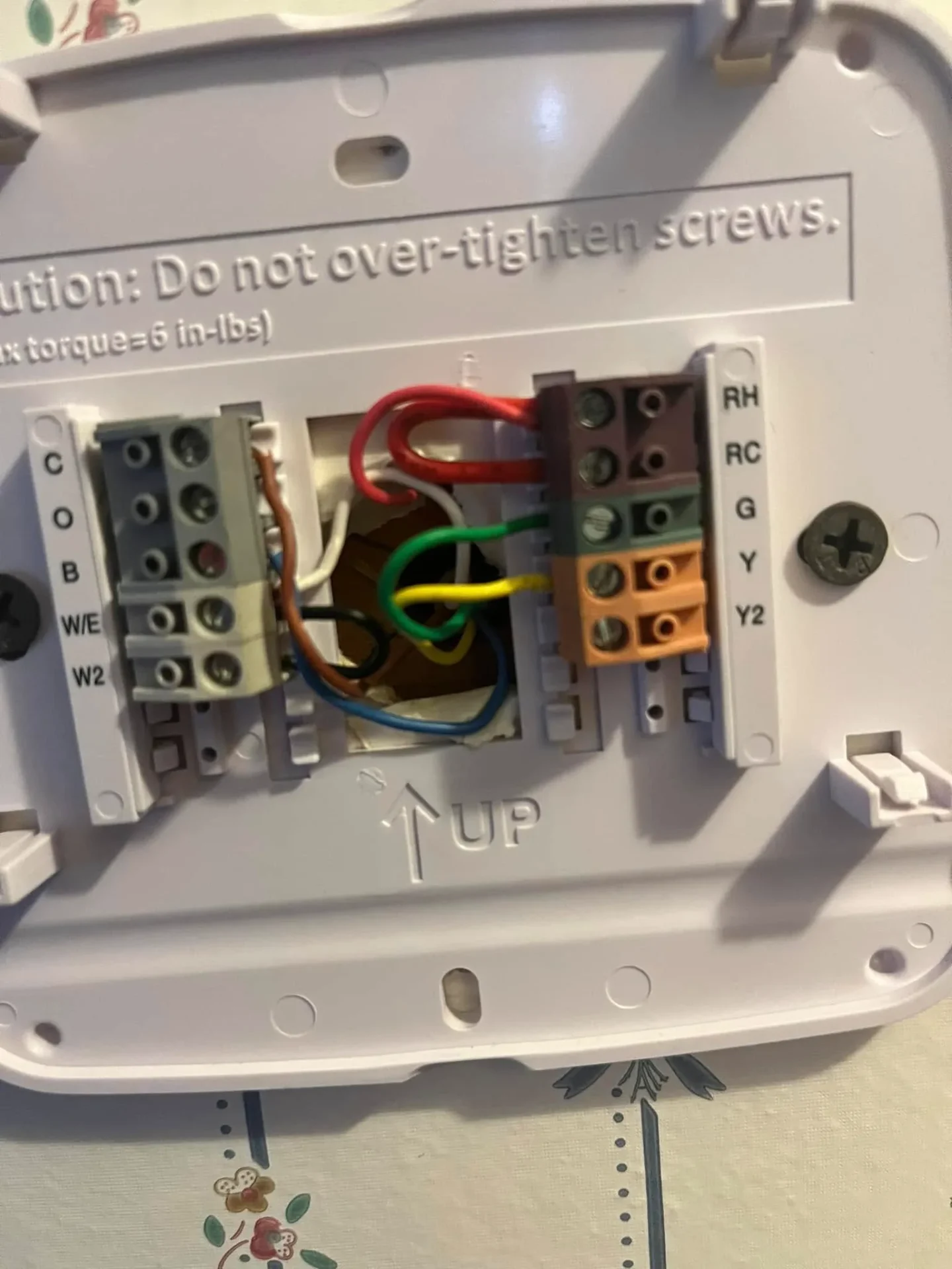 Thermostat wiring connections checked during furnace service