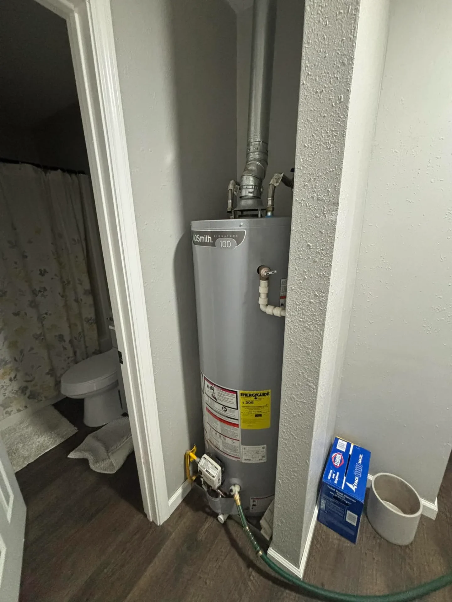 Gas water heater with vent serviced by Full Send Plumbing